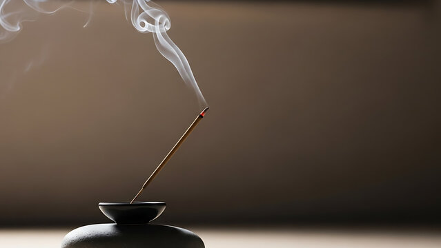 Aromatic incense stick burning, releasing smoke into a serene, softly lit space, creating a tranquil atmosphere for meditation or relaxation