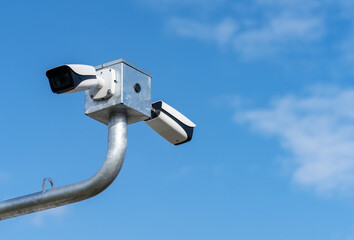 security camera on blue sky