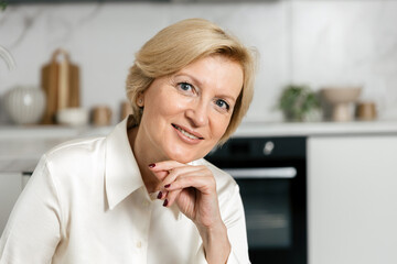 Happy woman enjoys her time at home during the weekend in her living space