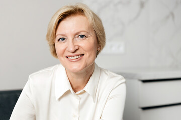 Happy woman enjoying her time at home with a smile on her face