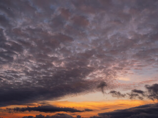 Obraz premium Dark dramatic sunset sky. Nature background for design. Strong colors.