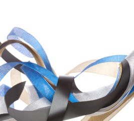 Colorful ribbon long straight fly in air with curve roll shiny. Blue silver gold black ribbon for present gift birthday party to wrap around decorate, blow fly in wind. White background isolated