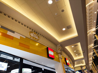 Fototapeta premium Bright Lego store interior in Manchester with yellow walls and modern lighting