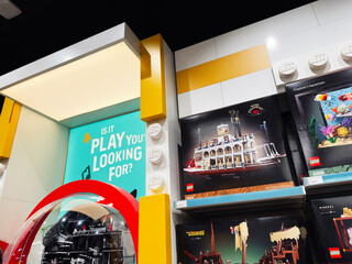 Fototapeta premium Lego display in a Manchester store with colorful brick sets and promotional signage