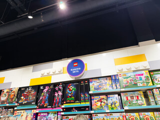 Fototapeta premium Shopping for LEGO gaming sets in a bright Manchester store with colorful boxes on display