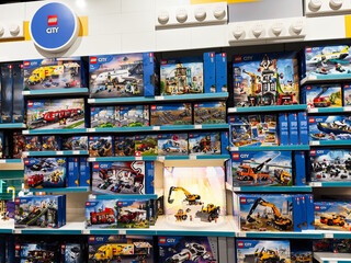 Obraz premium Lego City display in Manchester UK store shelves featuring boxes and colorful brick sets