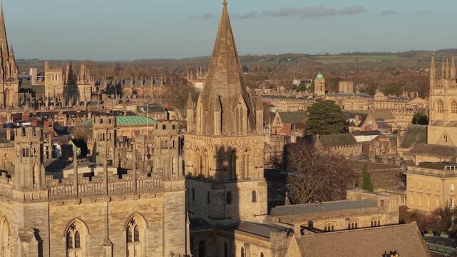 Oxford cityscape showing historic university buildings and church spires during golden hour