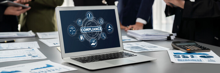 Panorama shot analyst team utilizing BI Fintech to analyze financial report with laptop. Businesspeople analyzing BI data dashboard displayed on laptop screen for business insight. Prodigy