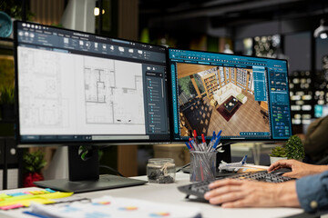 Male engineer arranging virtual assets in architectural software on computer, creating a detailed 3D render of a floor plan. Freelancer uses program for computer aided interior design.
