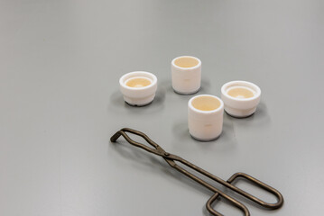 Forceps and grinding jars of mixer mills are used for the pulverization. Laboratory equipment.