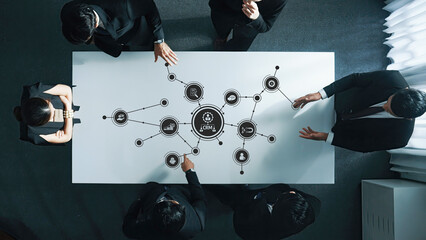 A team of professionals engaged in a dynamic business meeting, focusing on customer relationship management strategies to enhance efficiency and collaboration for future growth. Amity