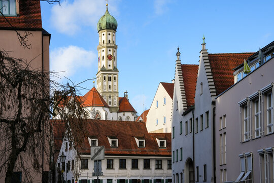 The building with the striking onion dome is the Catholic Basilica of St. Ulrich and Afra in Augsburg. It is located on Ulrichsplatz at the southern end of Maximilianstra&szlig;e.