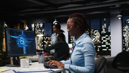 African american specialist handles neural networks systems for data forecasting, combining AI automation tools with digitalization to drive multinational company efficiency and innovation.