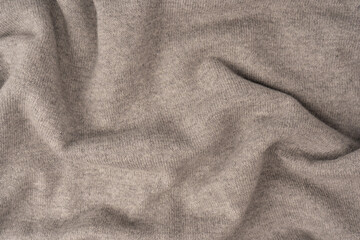 Soft grey merino wool sweater texture as a background.