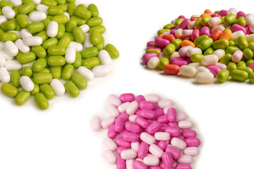 Sweet multicolored candies isolated on white background.