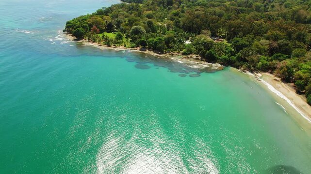 Aerial view of turquoise bay and sandy tropical coastline of Caribbean shore in Costa Rica