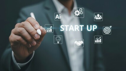 Businessman interacting with a digital interface displaying startup icons and the words START UP.