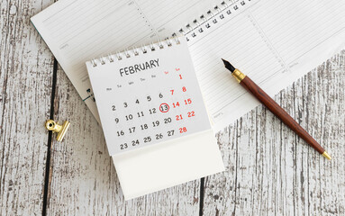 Display of a wooden calendar showing February 13,