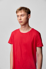 Young man, red t shirt, casual fashion, studio shoot, male model, lifestyle, fashion, neutral...