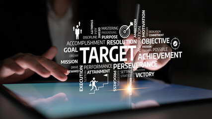 A close-up view of hands interacting with a tablet, surrounded by words related to targets,...