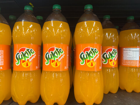 BELO HORIZONTE, MG/BRAZIL, JANUARY, 06, 2026: A shelf of Sakita orange soda bottles in a store