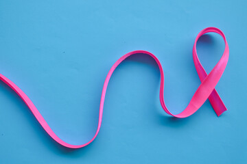 Pink ribbon on blue background. Breast Cancer Awareness. 