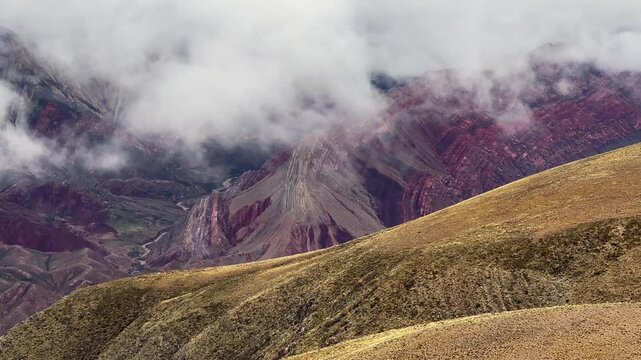Panning footage of Serrania de Hornocal in Jujuy, Argentina. World Heritage Site. Panoramic view. Foggy and cloudy day