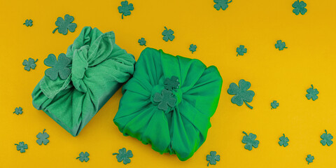 Handmade St. Patrick's Day gift concept. Furoshiki, decorative symbols, crocheted leprechaun hat