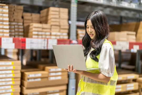 Female engineers discussing inventory in warehouse logistics and supply chain planning, operation management, data analysis, warehouse shipping, inventory tracking, optimization and technology - Powered by Adobe