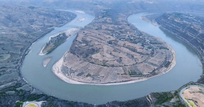 Aerial time-lapse of the Qiankun Bay, where the Yellow River makes a breathtaking meander through the Loess Plateau in Yan&rsquo;an, Shanxi Province, China.
