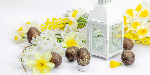Festive Easter composition with traditional decoration. Spring flowers, Eggs, flower lantern