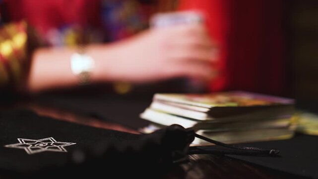 Process of tarot card reading and future fate prediction, fortune teller medium with a deck of divination cards tells a destiny forecast, female tarot reader fortune telling, esoteric and astrology