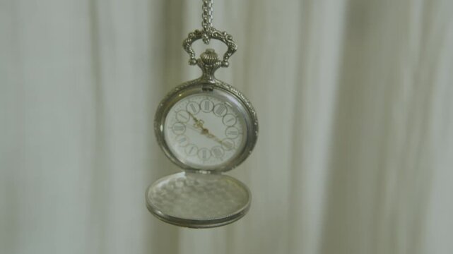 Classic watch face with roman numerals close up.