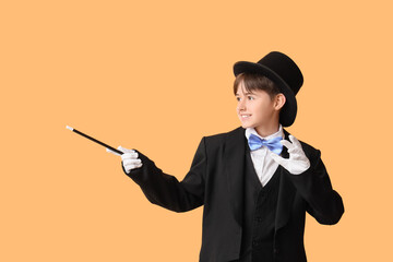 Little magician on beige background
