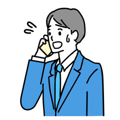 スーツ姿の若い男性が困った表情で電話しているイラスト