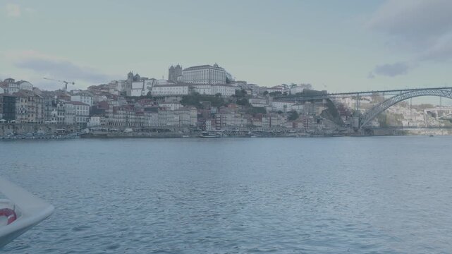 Panoramic view of Porto city seen across the Douro River under soft daylight.