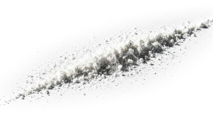 Obraz premium Fine white powder scattered in a line against a clean white background