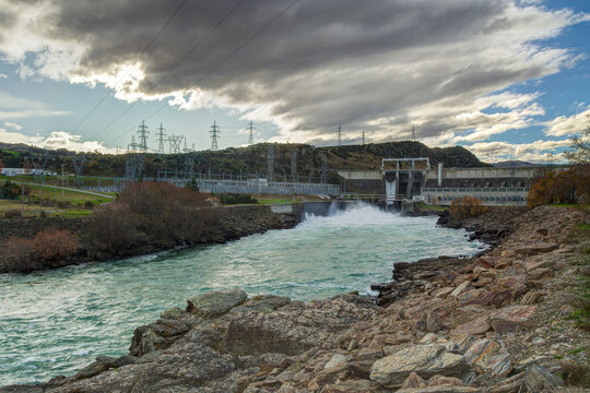 The Roxburgh hydroelectric dam releasing water into the Clutha River in the South Island of New Zealand