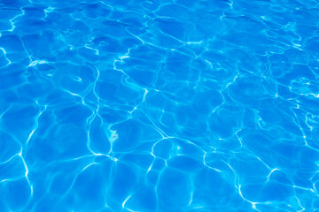 The light reflects blue in the water in the swimming pool. It looks fresh and lively, suitable for use as a wallpaper.