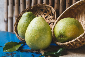 Fresh pomelos on the dark background, healthy fruit