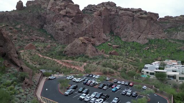 large car parking lot at hiking trail park entrance camelback mountain canyon echo phoenix scottsdale arizona (az southwest) aerial cars parked station standing garage drive hike famous southwest