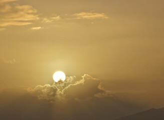 Sun rising above the clouds in Alaska