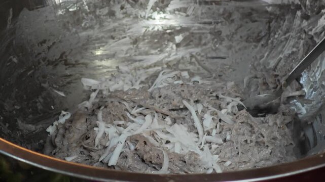 Nipa palm dessert. Sticky rice flour, palm sugar and shredded coconut meat.