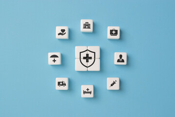 Health insurance and medical care concept. A set of dice displaying health-related icons, medical care, health insurance, and medication. healthcare services, protection, insurance coverage