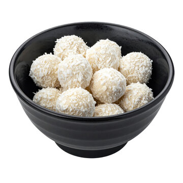 Appetizing qurut balls, a traditional dried yogurt snack, on a dark plate against a white isolated background