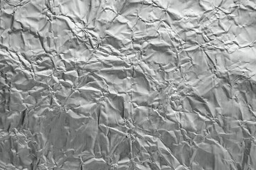 Shiny metal silver gray foil leaf crumpled texture background