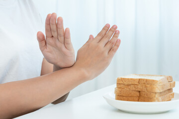 Wheat allergy, gluten allergy, women refuse to eat bread, swollen mouth, swollen eyes, itchy rash, hives, stuffy nose, difficult breathing, itchy eyes, stomach pain, nausea, vomiting, diarrhea