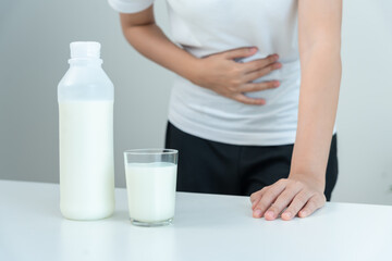 Milk allergens, woman felling stomachache and diarrhea , runny stuffy sore nose suffer from intolerance allergy trigger symptoms. abdominal pain nut protein, rash, death, food allergy