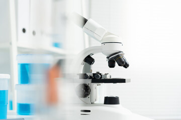 Scientist analyze biochemical samples in advanced scientific laboratory. Medical professional use microscope look microbiological developmental of viral. Biotechnology research in science lab.