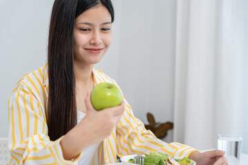 slim body asian women choose healthy foods, dieting female choose green apple for diet. Good healthy food. weight lose, balance, control, reduce fat, low calories, routines, exercise, body shape.